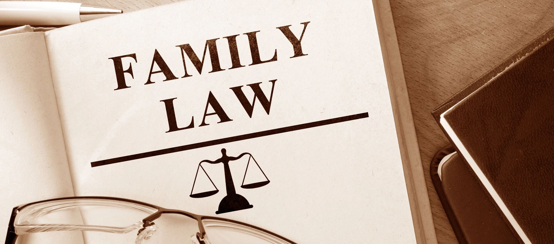 A close-up of a family law document with scales of justice symbol.