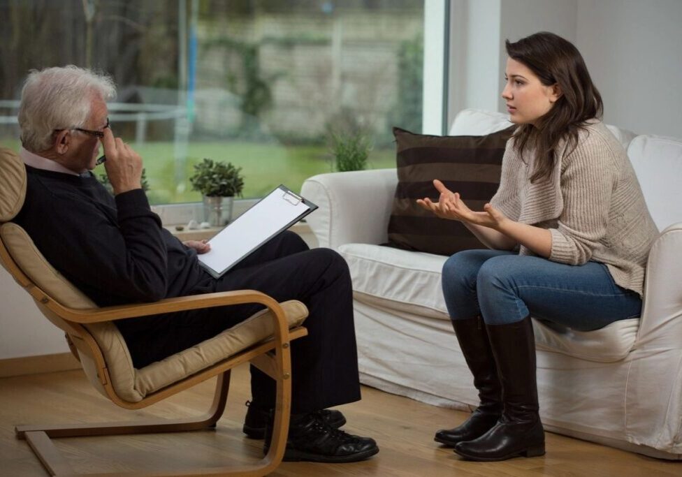 A woman discussing her thoughts during a therapy session.