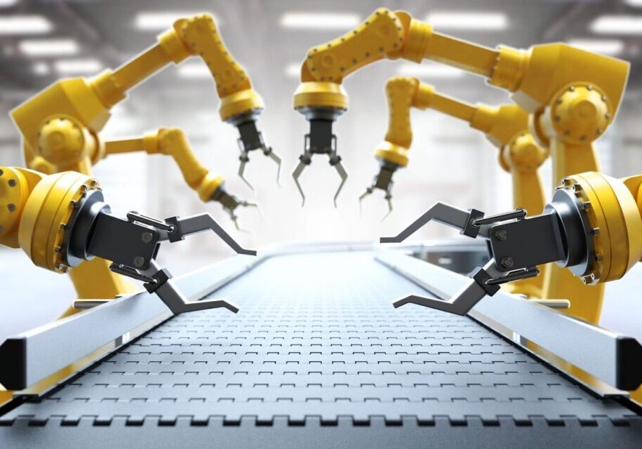 Robotic arms assembling components on a production line.
